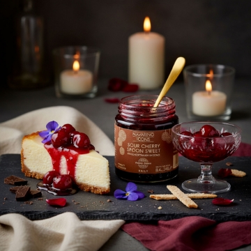Elegant Sour Cherry Dessert Idea | Navarino Icons Festive Edition An elegant dessert serving of Navarino Icons Sour Cherry Spoon Sweet poured over cheesecake and presented in a crystal dessert glass.
