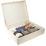 Open wooden gift box by Elenianna containing authentic Greek products: Navarino Icons extra virgin olive oil, Mouriki honey, Cretan Tsikoudia spirit, Kalamon olives, and gourmet preserves against a white background.